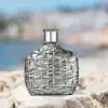 John Varvatos XX Artisan EDT 125ml with a silver-wrapped bottle and crown logo, delivering a refined woody fragrance.