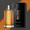 Hugo Boss The Scent 100ml Eau de Toilette Spray featuring a modern design and warm amber hue.