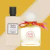 Hermès Twilly d’Hermès Eau Ginger set showcasing the fragrance bottle adorned with a silk ribbon and matching body lotion.​