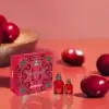 Close-up of Amor Amor 100 ml and 30 ml perfume bottles