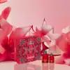 Cacharel Amor Amor set displayed on romantic pastel background