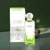 Hermès Un Jardin Sur Le Toit 100ml EDT bottle, reflecting the scent's blend of fruity and green notes.