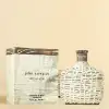 Luxury citrus men's perfume by John Varvatos, front bottle view