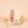 100 ml Absolue Le Parfum spray positioned with white tea leaves