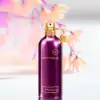 Juicy plum and red berries heart layered on teak‑amber musk base