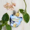 Violet and licorice heart over vanilla‑praline patchouli base