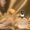 Cardamom‑pepper top with solar tuberose heart over warm amber cashmeran base