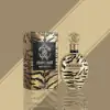 Bold citrus-spice opening into oud-amber vanilla heart and smooth sandalwood finish