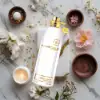 Warm, elegant unisex oud with powdery floral and vanilla