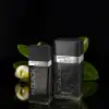 Jacomo In Black perfume bottle — clean fougère mid, warm amber-woody dry-down